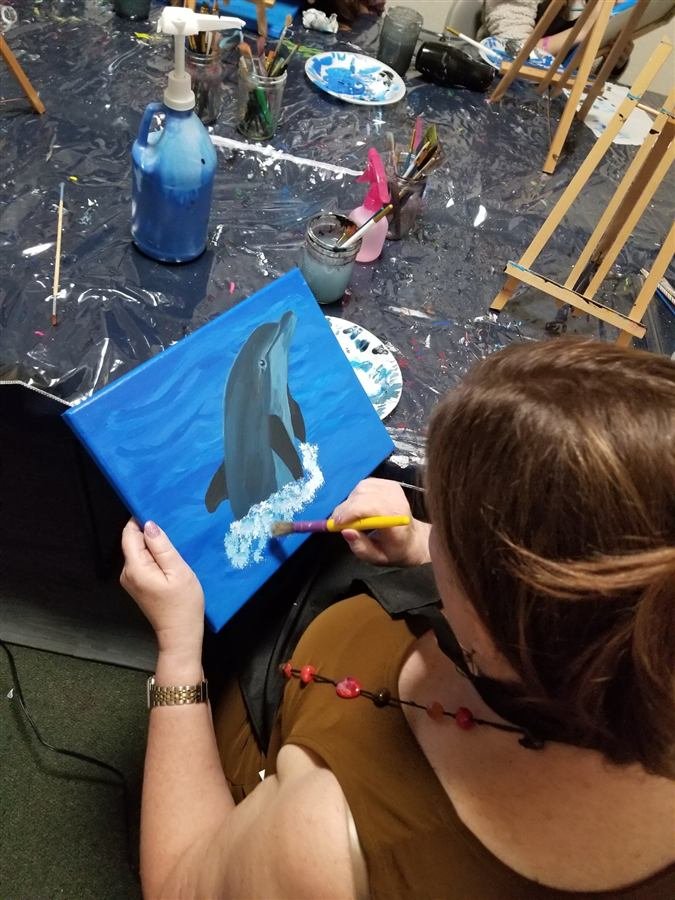 Students painting at one of Wilhelmina's classes
