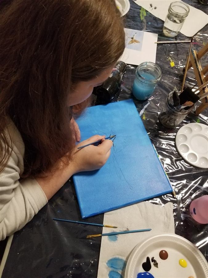 Students painting at one of Wilhelmina's classes
