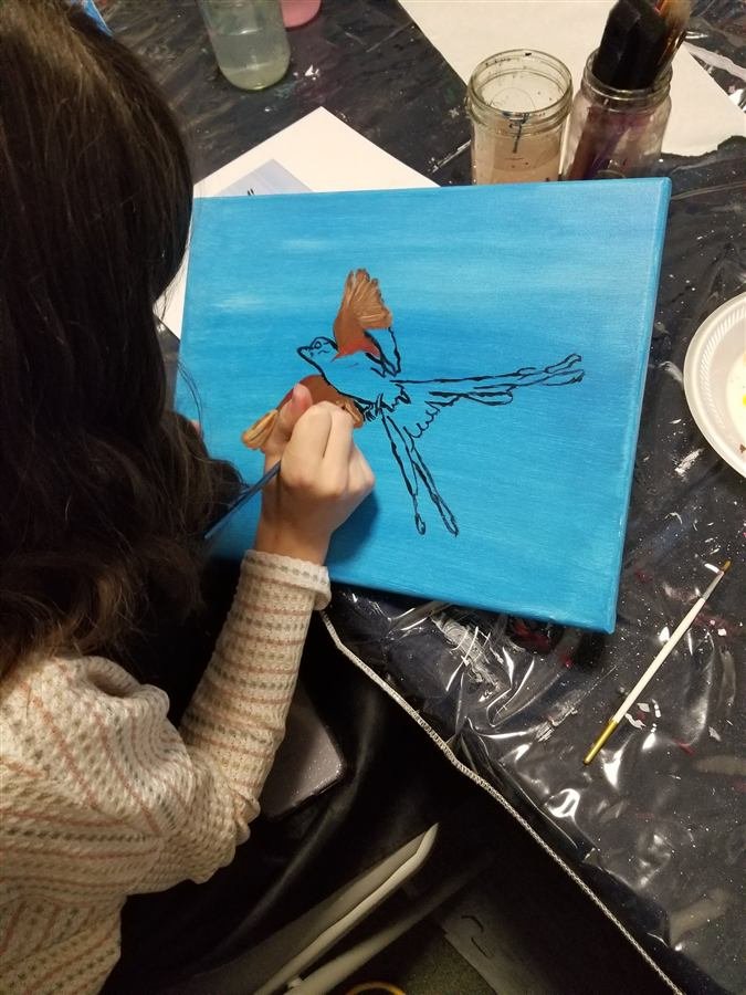 Students painting at one of Wilhelmina's classes
