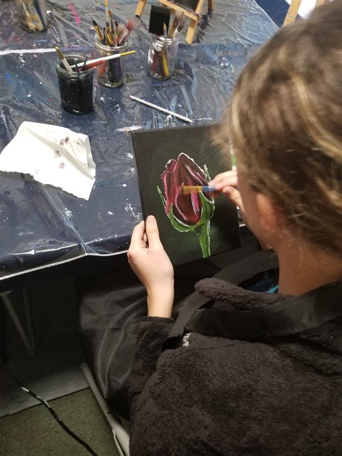 Students painting at one of Wilhelmina's classes