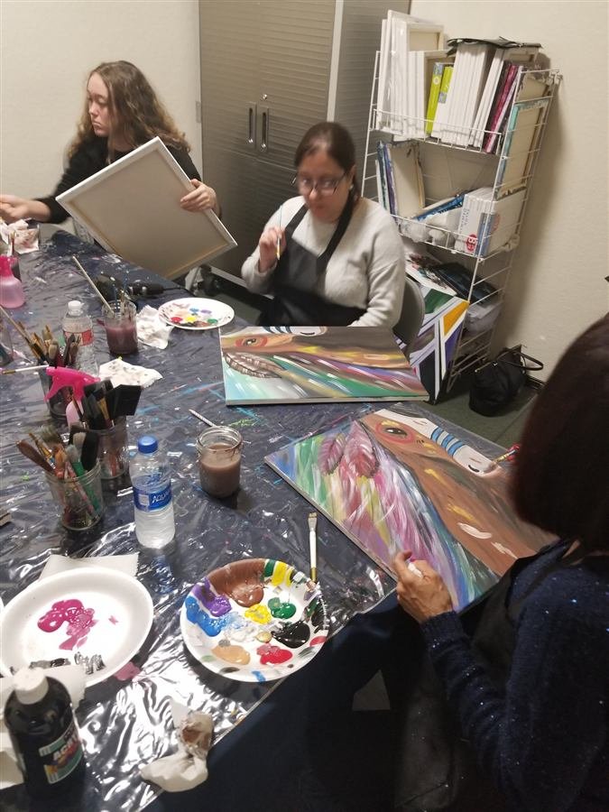 Students painting at one of Wilhelmina's classes