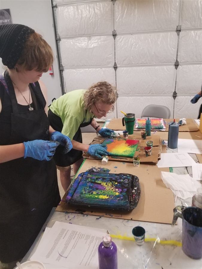 Students painting at one of Wilhelmina's classes